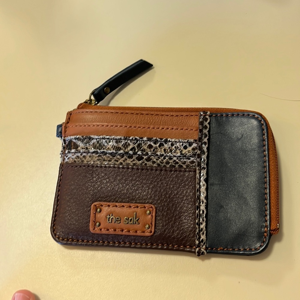 The Sak wallet with card pockets and one larger zipper pocket.